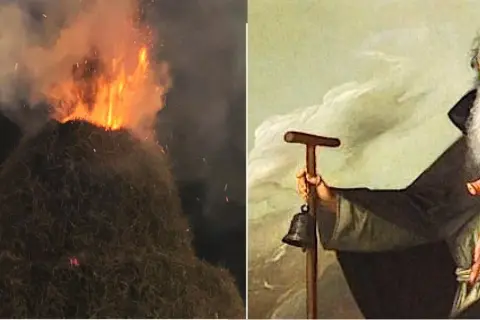 Falò e un dipinto di Sant'Antonio Abate con un maialino, che evoca la leggenda del santo protettore degli animali.