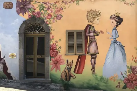 Un principe offre un fiore a una principessa, circondati da fiori e un volpe. Sembra un dipinto del paese delle fate.