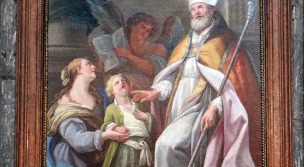 San Biagio, con mitra e pastorale, benedice un bambino. Il nome Biagio evoca protezione e guarigione.