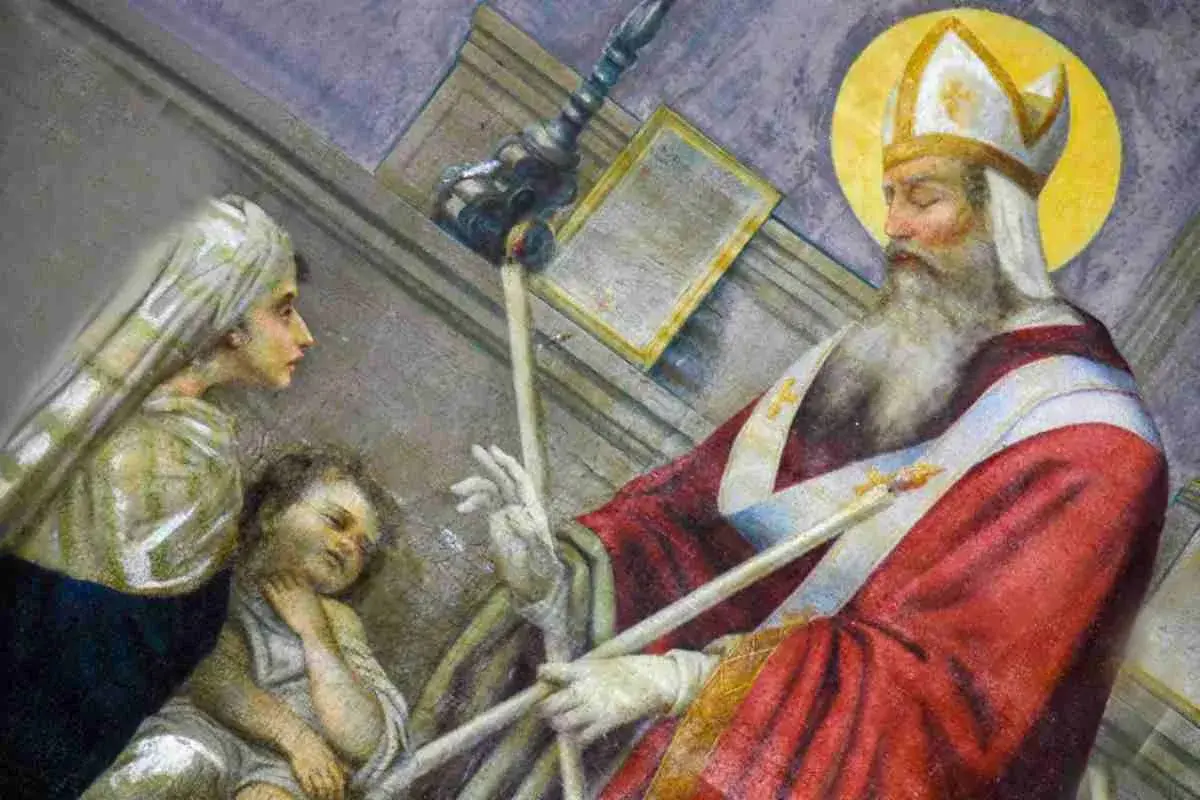 La storia di San Biagio: il santo vescovo benedice un bambino con una spina in gola, mentre una donna osserva.